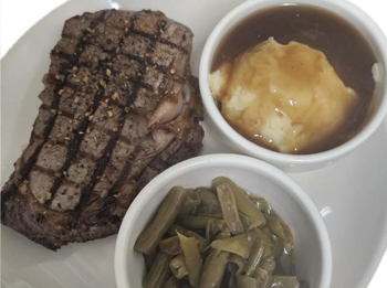 Ribeye, green beans, and mashed potatoes